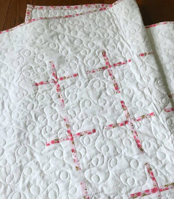Closeup of Pink and White Christening Quilt