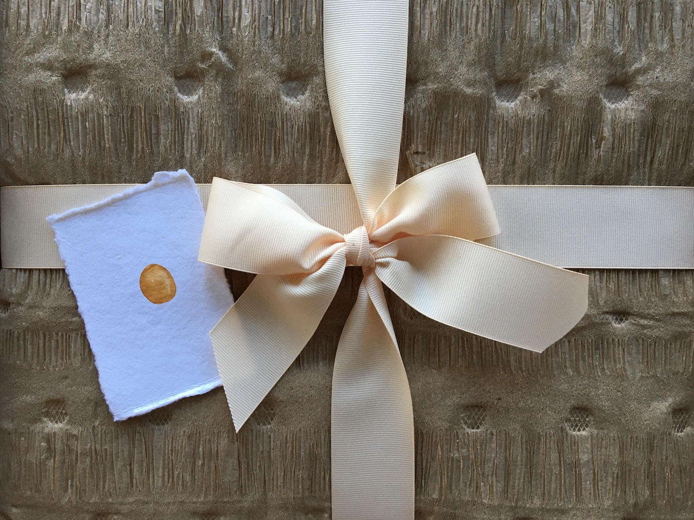 Unwrapped package with notecard