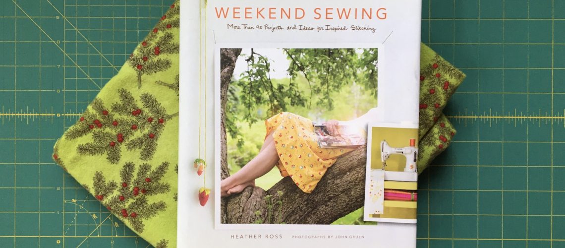 Green flannel with pine and berry print and the book Weekend Sewing by Heather Ross