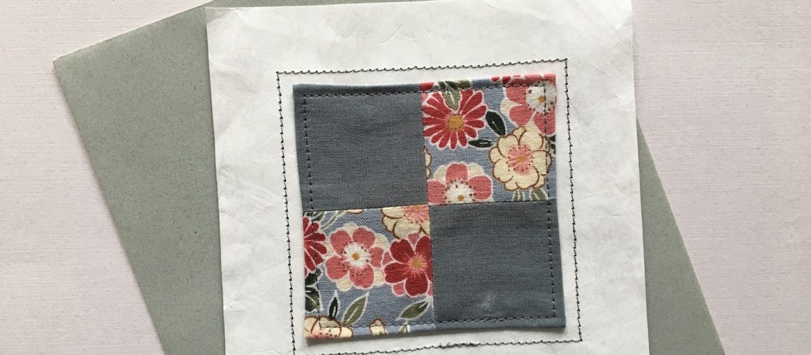 Quilt block stitched to white Tyvek Envelope
