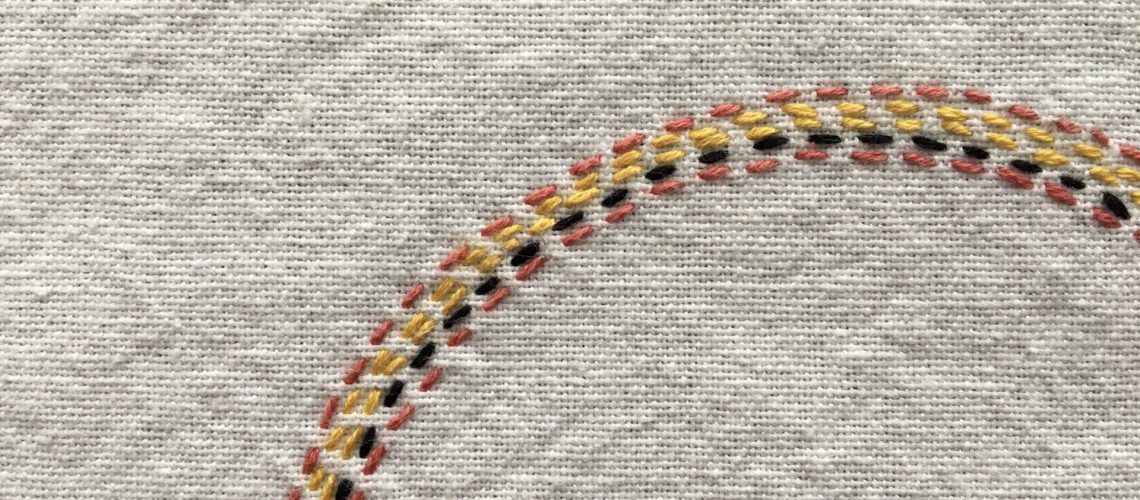 Up close image of embroidered arcs